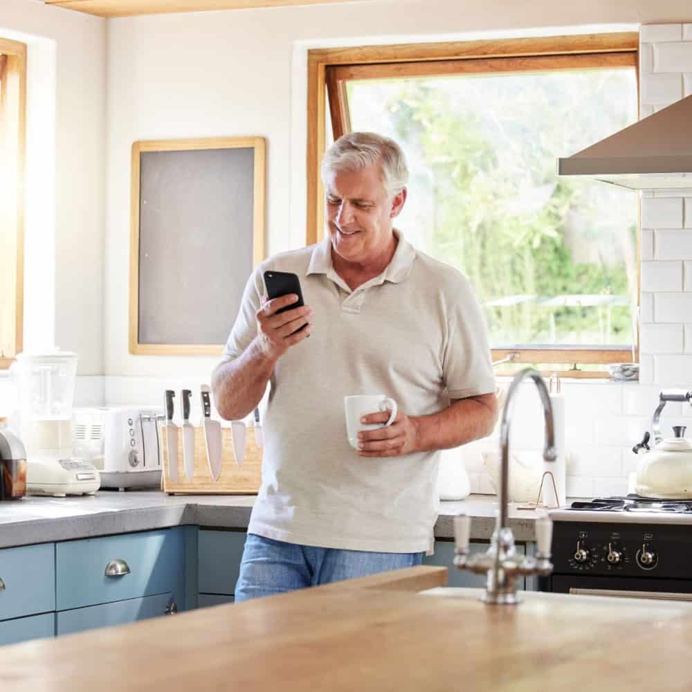 confident mature man consulting with doctor virtually.