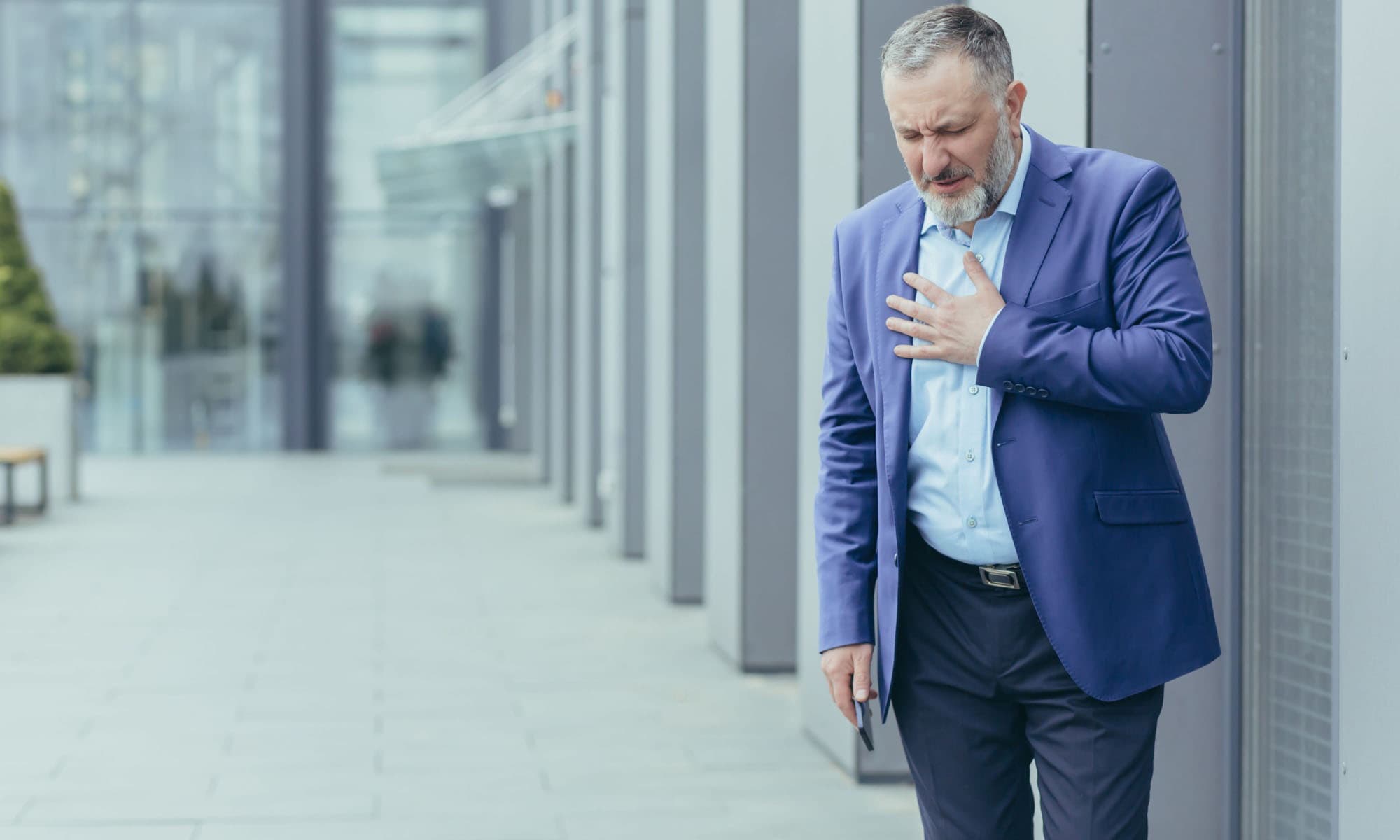 mature man experiencing sudden daily heartburn.