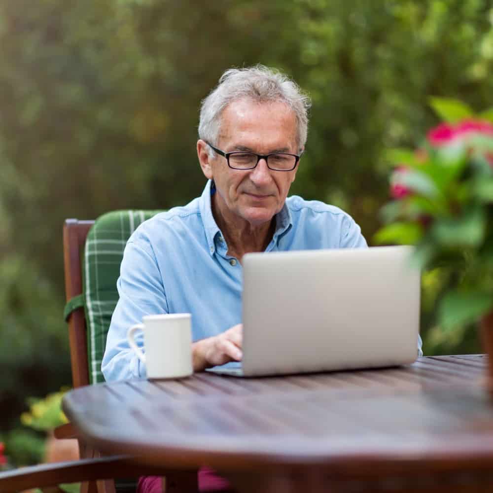mature man reviewing health records for upcoming appointment.