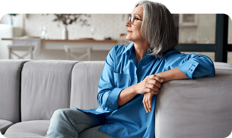 relaxed middle aged woman practicing stress management.